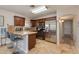 Well-lit kitchen featuring stainless steel appliances, warm wood cabinets, and a practical breakfast bar area at 3041 E Roma Ave, Phoenix, AZ 85016