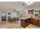 Open kitchen space next to dining area, with ample cabinet storage and a convenient serving bar at 3041 E Roma Ave, Phoenix, AZ 85016