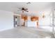 Open-concept living room seamlessly connects to the kitchen, creating a modern and inviting living space at 32160 N Dog Leg Ct, San Tan Valley, AZ 85143