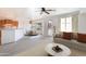 Open-concept living room and dining area features neutral tones, updated flooring, and a large window for natural light at 32160 N Dog Leg Ct, San Tan Valley, AZ 85143