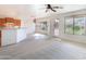 Bright and airy living room with seamless flow to the breakfast nook and outdoor views through a large window at 32160 N Dog Leg Ct, San Tan Valley, AZ 85143