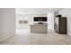 Modern open-concept kitchen boasts stainless steel appliances and ample counter space at 35450 N Breezy Ln, San Tan Valley, AZ 85140