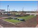 Bocce ball court and seating with a basketball court and covered picnic area in the background at 36971 W Santa Maria St, Maricopa, AZ 85138