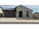 Charming single-story home featuring a neutral color palette, tile roof, and attached two-car garage at 36971 W Santa Maria St, Maricopa, AZ 85138