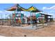 Colorful community playground with slides, climbing structures, and sunshades for a fun recreational area at 36971 W Santa Maria St, Maricopa, AZ 85138