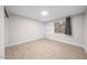 Empty bedroom featuring tile flooring and natural lighting at 3744 E Evans Dr, Phoenix, AZ 85032