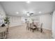 Spacious dining area featuring tile floors, neutral walls, a modern light fixture, and ample natural light at 3744 E Evans Dr, Phoenix, AZ 85032