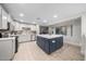 Spacious kitchen with an island, stainless appliances, and a window to the outside pool area at 3744 E Evans Dr, Phoenix, AZ 85032
