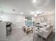 Bright living room with tile floors, neutral tones, access to the backyard, and a ceiling fan at 3744 E Evans Dr, Phoenix, AZ 85032
