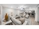 Spacious living room with tile floors, neutral walls, comfortable seating, and an open layout at 3744 E Evans Dr, Phoenix, AZ 85032
