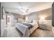 Spacious primary bedroom with a ceiling fan, neutral colors, and carpet at 3744 E Evans Dr, Phoenix, AZ 85032