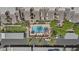 Aerial view of community pool, lush landscaping, and residential buildings with ample parking at 3845 E Greenway Rd # 230, Phoenix, AZ 85032