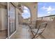 Charming balcony with tile floors, seating, and views of the surrounding landscape at 3845 E Greenway Rd # 230, Phoenix, AZ 85032
