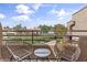 Inviting balcony with woven chairs offering a view of the well maintained community at 3845 E Greenway Rd # 230, Phoenix, AZ 85032