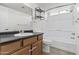 Bathroom with dark countertops, honey-colored cabinets and a shower-tub combination at 3845 E Greenway Rd # 230, Phoenix, AZ 85032