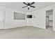 Bedroom with neutral carpet, ceiling fan, recessed niche for TV, and an open closet at 3845 E Greenway Rd # 230, Phoenix, AZ 85032
