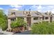 Attractive multi-story residential building boasting a tiled roof, private balconies, and lush landscaping at 3845 E Greenway Rd # 230, Phoenix, AZ 85032