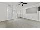 Spacious upstairs living room with carpet, a ceiling fan, and views to another room and the stairway at 3845 E Greenway Rd # 230, Phoenix, AZ 85032