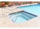 Swimming pool with a hot tub and lounge chairs at 3845 E Greenway Rd # 230, Phoenix, AZ 85032