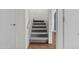 Stairway with carpeted steps, a white handrail, and views leading to other rooms in the home at 3845 E Greenway Rd # 230, Phoenix, AZ 85032