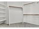Spacious walk-in closet featuring ample shelving and wood closet rod storage at 3845 E Greenway Rd # 230, Phoenix, AZ 85032