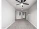 Bedroom features neutral carpet, ceiling fan, and mirrored closet doors at 4210 W Calavar Rd, Phoenix, AZ 85053