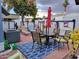 Outdoor patio with dining set and colorful decor is perfect for entertaining at 44 S Hawes Rd # B7, Mesa, AZ 85208