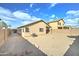 Large, sandy backyard surrounded by block wall fencing ensuring privacy at 4613 W Ellis St, Laveen, AZ 85339