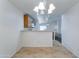 Open dining area with tile floors and easy access to the kitchen and living spaces at 4613 W Ellis St, Laveen, AZ 85339