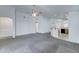 Open concept living area leading into the kitchen with a breakfast bar at 4613 W Ellis St, Laveen, AZ 85339