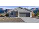 Charming single-story home with a modern design and a desert landscape at 5568 E Rock Bush Ln, San Tan Valley, AZ 85140