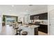 Stylish kitchen featuring a large island with seating and modern stainless steel appliances at 5568 E Rock Bush Ln, San Tan Valley, AZ 85140