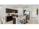 Modern kitchen featuring stainless steel appliances and a kitchen island with bar stool seating at 5568 E Rock Bush Ln, San Tan Valley, AZ 85140