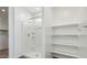Bathroom features a walk-in shower with white fixtures, plus shelving at 5742 E Smeaton Pl, San Tan Valley, AZ 85140