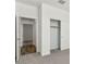Bedroom featuring a closet with sliding doors and neutral carpeting at 5742 E Smeaton Pl, San Tan Valley, AZ 85140