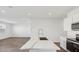 Spacious kitchen with an island overlooking the living area at 5742 E Smeaton Pl, San Tan Valley, AZ 85140