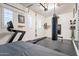 Home gym with treadmill, punching bag, mirror, and rubber flooring at 6130 E Bramble Berry Ln, Cave Creek, AZ 85331