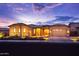 Charming single-Gathering home showcasing a well-manicured front yard and inviting curb appeal at dusk at 6130 E Bramble Berry Ln, Cave Creek, AZ 85331