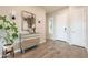 Bright and airy foyer featuring a mirrored console table, stylish decor, and a welcoming entrance at 6130 E Bramble Berry Ln, Cave Creek, AZ 85331