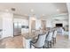 Bright and airy kitchen with a center island, stainless steel appliances, and an open layout to the living area at 6130 E Bramble Berry Ln, Cave Creek, AZ 85331