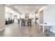 Open-concept kitchen with stainless steel appliances, breakfast bar, and sleek tile flooring at 6130 E Bramble Berry Ln, Cave Creek, AZ 85331