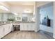 Elegant bathroom with double vanity, granite countertops, wooden tile flooring, and stylish fixtures at 6130 E Bramble Berry Ln, Cave Creek, AZ 85331