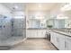 Luxurious bathroom with glass shower, double vanities, granite countertops, and ample natural light at 6130 E Bramble Berry Ln, Cave Creek, AZ 85331