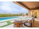 Inviting patio with pool, lounge area, outdoor dining space, and desert views at 6130 E Bramble Berry Ln, Cave Creek, AZ 85331