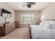 Bright main bedroom featuring neutral walls, carpet floors, and a window with plantation shutters at 6765 S Jacqueline Way, Gilbert, AZ 85298