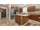 Bright kitchen with stone countertops, stainless steel appliances, and ample cabinet space at 715 E Blossom Rd, San Tan Valley, AZ 85143