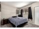 Comfortable bedroom with a queen-sized bed, closet, and large window for natural light at 715 S Extension Rd # 70, Mesa, AZ 85210
