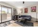 Bright living room features a sliding glass door to a balcony and stylish decor at 715 S Extension Rd # 70, Mesa, AZ 85210
