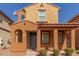 Charming home with a covered porch, showcasing architectural details and a welcoming facade at 7838 W Palm Ln, Phoenix, AZ 85035