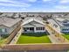 An aerial view shows the home with a manicured backyard in a quiet neighborhood at 8140 E June St, Mesa, AZ 85207